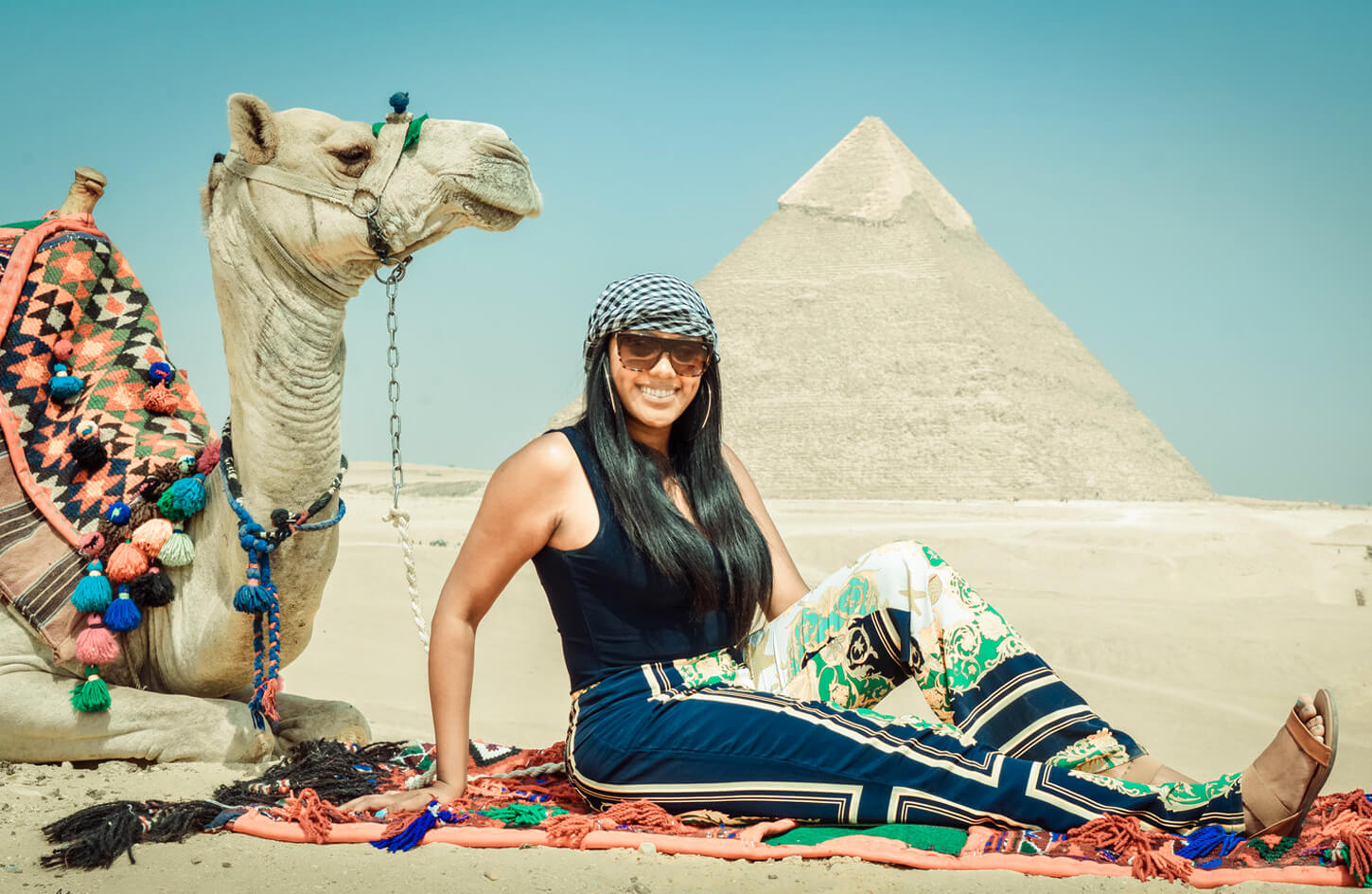 Great-picture-of-a-girl-in-front-of-the-pyramids-with-a-camel
