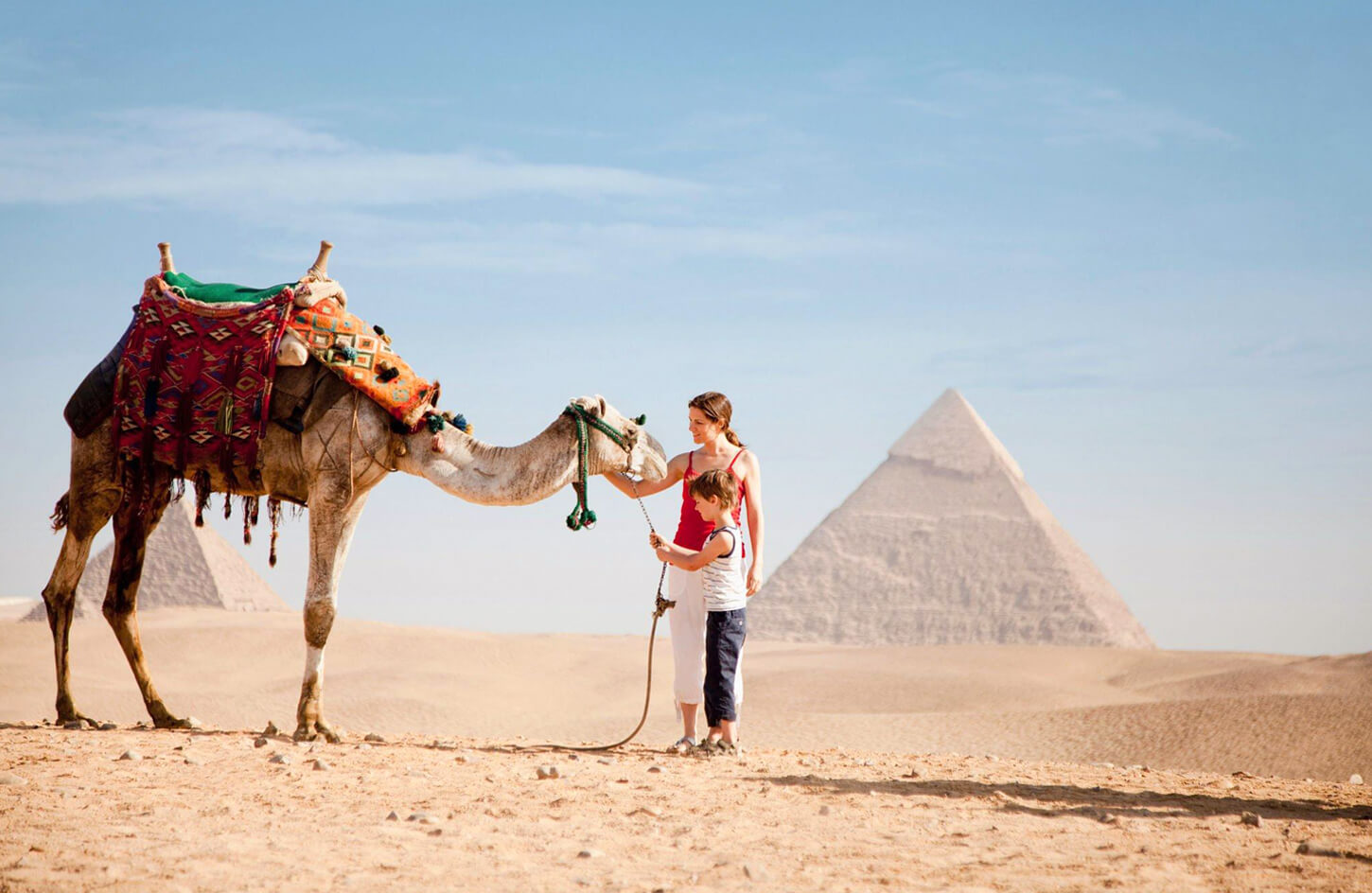Wonderful-picture-of-a-little-boy-and-his-mother-with-a-camel-in-front-of-the-pyramids